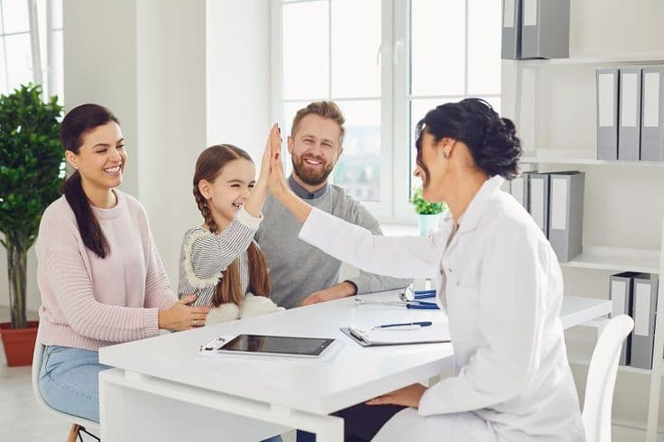 happy family on a visit to the stock photo containing doctor and family