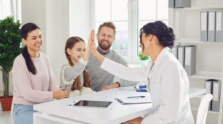 happy family on a visit to the stock photo containing doctor and family